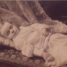 Child on cushions and sofa